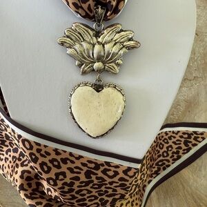 Hand carved bone heart with repousse Tibetan silver